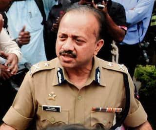 Deven Bharti in police uniform speaking to reporters during his Crime Branch years.