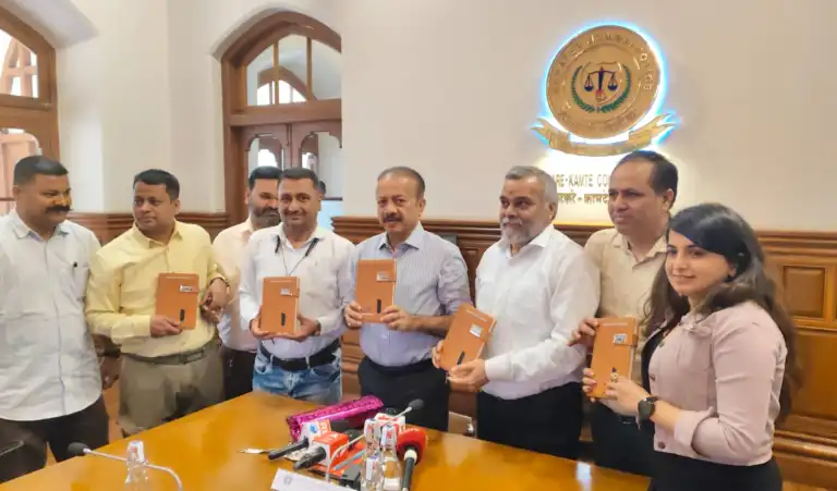 Deven Bharti with police officers and staff at a formal institutional briefing in a police conference room.