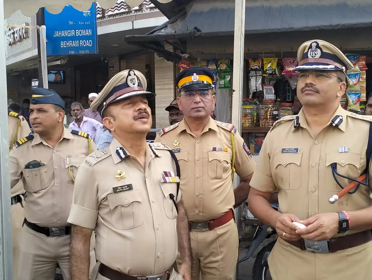Deven Bharti with senior Mumbai Police officers inspecting a street location in the city.